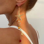 Boucles d'oreilles pendantes bohème à pompons — Étoile de mer et coquillage