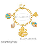 Gold-tone shell charm necklace with octopus pendant and blue enamel round shell center.