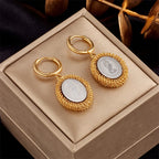 Gold-tone hoop earrings with round mesh locket drops