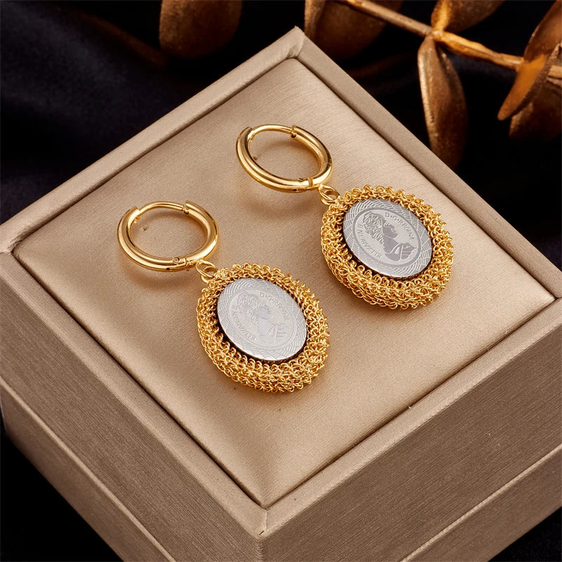 Gold-tone hoop earrings with round mesh locket drops