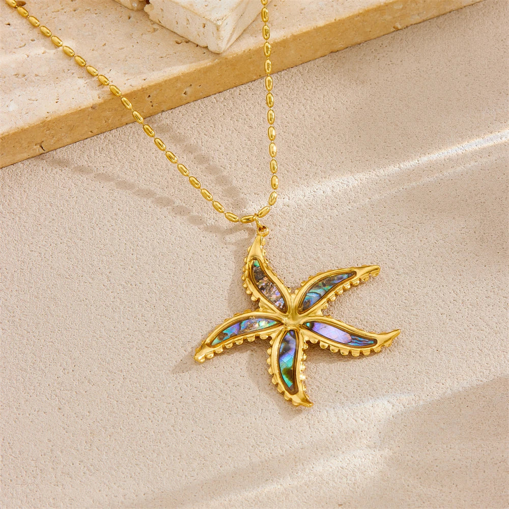 Starfish flower pendant necklace with gold-tone chain and blue enamel starfish
