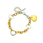 Two-tone heart charm chain bracelet with gold heart pendant and silver heart links