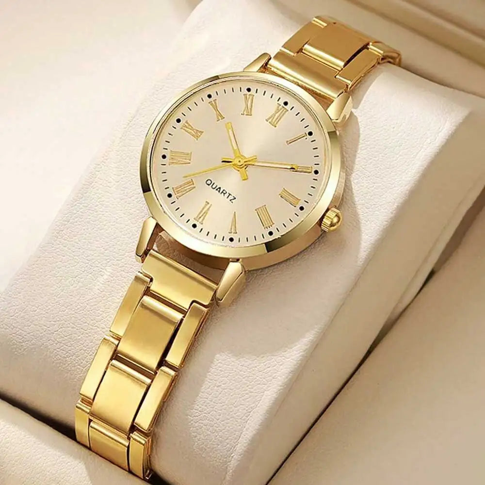 Gold-tone quartz watch with white dial and metal link bracelet, round bezel detail
