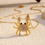 Rhinestone crab pendant necklace with gold-tone crab charm and link chain