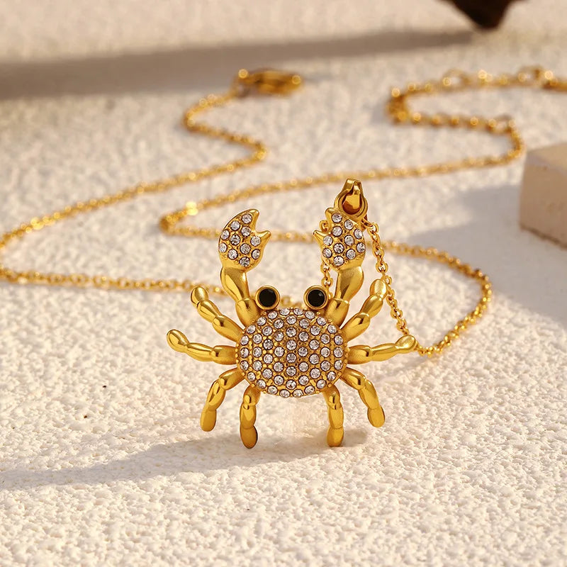 Rhinestone crab pendant necklace with gold-tone crab charm and link chain