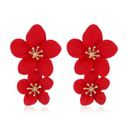 Red double-layer flower dangle earrings with gold-tone star centers