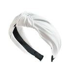 Wide PU leather headband in white with twisted knot top and elastic ends