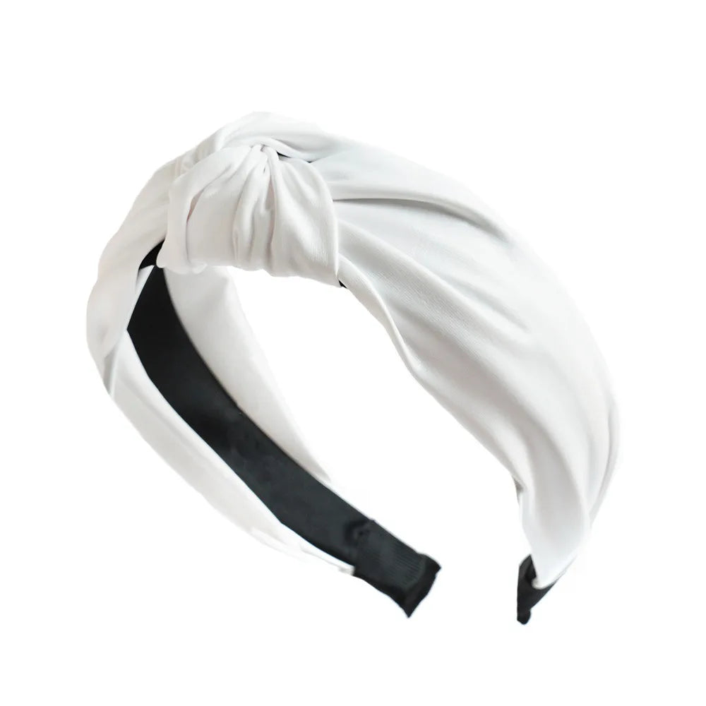 Wide PU leather headband in white with twisted knot top and elastic ends