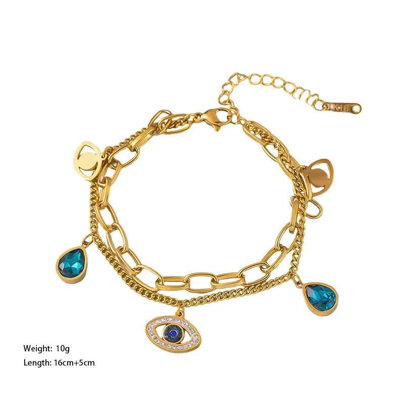 Gold-tone evil-eye double bangle bracelet with blue drop and eye charms
