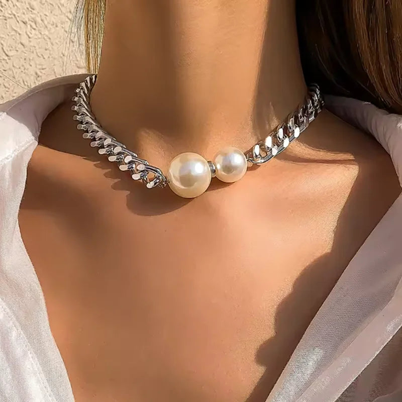 Silver-tone Cuban chain necklace with two round pearl beads on the front
