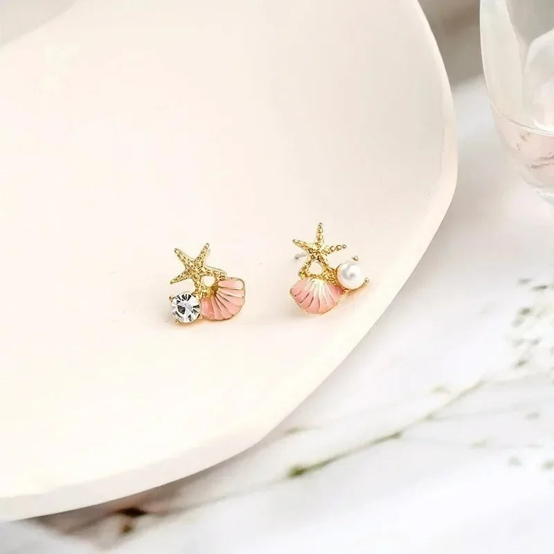 Boucles d'oreilles pendantes bohème à pompons — Étoile de mer et coquillage