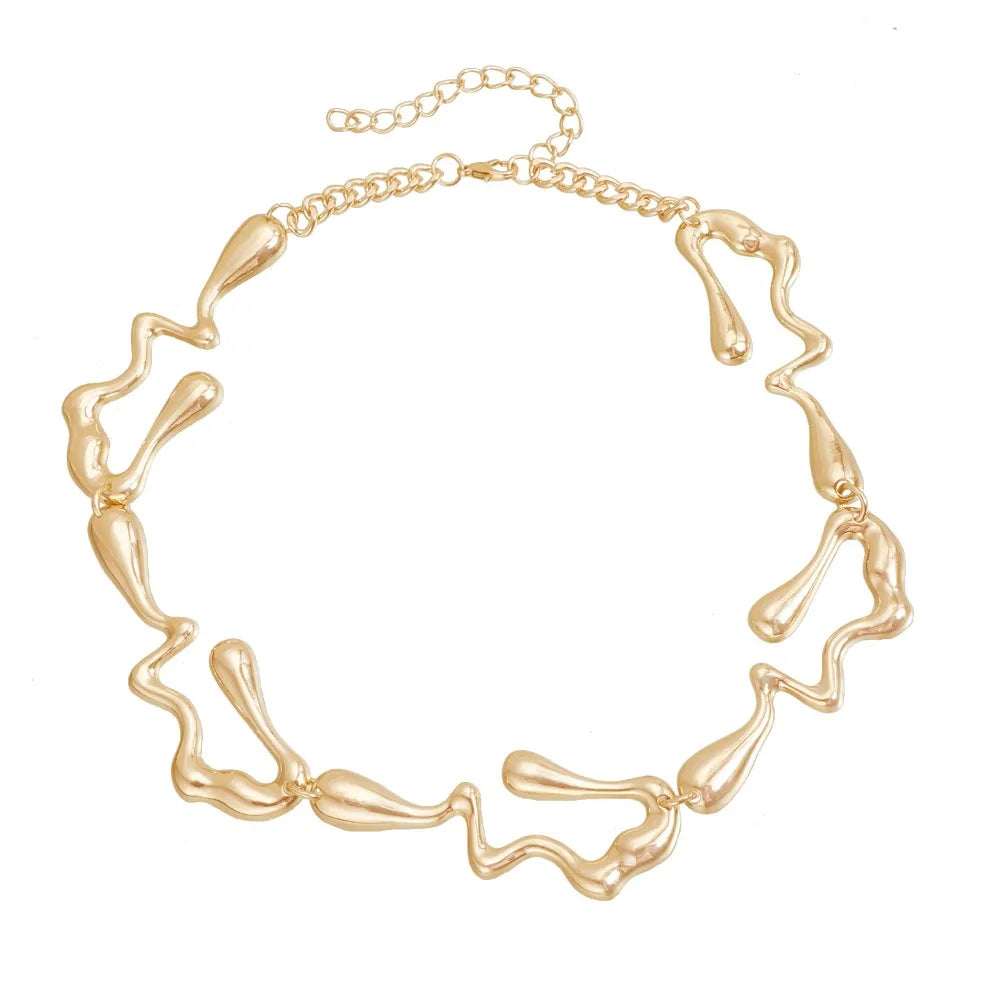 Gold-tone lava-drop choker necklace with abstract sculpted link design