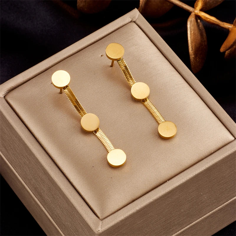 Gold hoop earrings with three round disc drops on fine chain