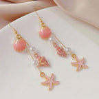 Boucles d'oreilles pendantes bohème à pompons — Étoile de mer et coquillage