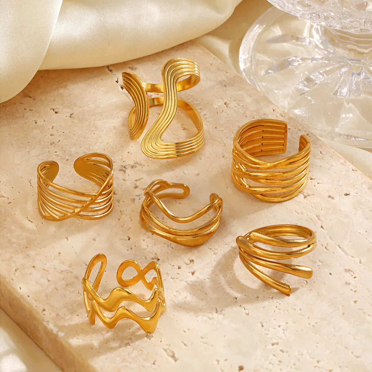 Geometric open stacking rings assortment, gold-tone curved open ribbed bands