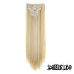 Light blonde straight clip-in hair extension with metal comb clips at the top