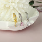 Titanium belly button clicker hoops with crystal teardrop charms, gold and silver tones