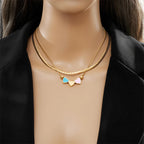 Gold double-layer heart necklace with blue and pink enamel heart charms