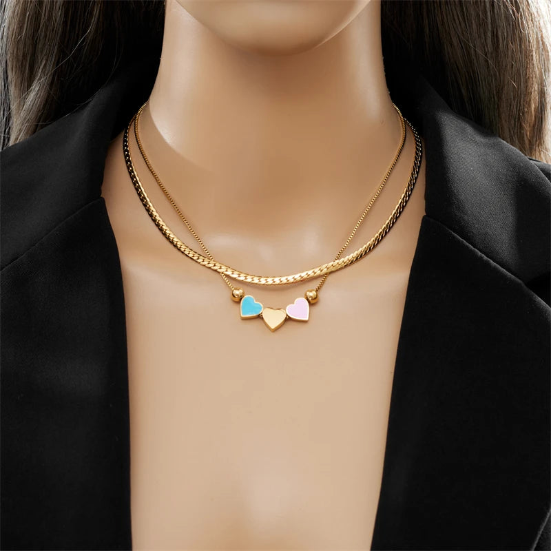 Gold double-layer heart necklace with blue and pink enamel heart charms