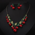 Cherry fruit necklace and earrings set, red bead cherries with green and gold leaf accents