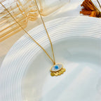 Evil-eye pendant choker necklace, gold chain with blue eye charm and scalloped dangles