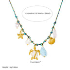 Sea turtle and starfish multi-pendant necklace with shell, pearl, and blue charm