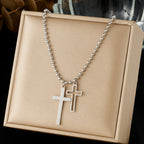 Silver cross pendant necklace with double cross charm on a beaded chain