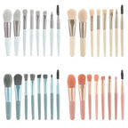 Makeup brush assortment with gray, beige, and gold handles; includes mascara spoolie
