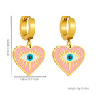 Gold-tone heart drop earrings with turquoise evil eye center