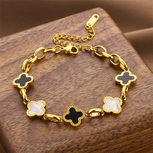 Gold-tone clover charm bracelet with five four-leaf enamel charms