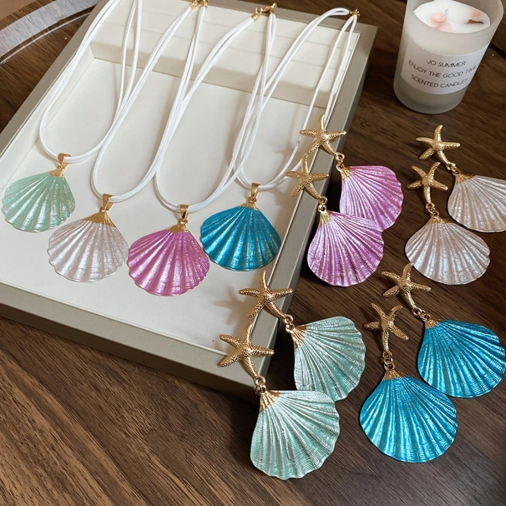 Starfish shell dangle earrings with gold starfish and multicolor shell drops
