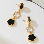 Five-petal flower long drop earrings, gold-tone with black enamel clover and crystal details