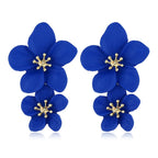 Pink double-layer flower dangle earrings with gold-tone star centers