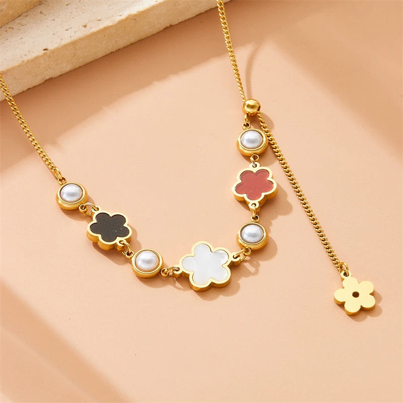 Gold-tone five-petal flower necklace with mixed-color enamel charms and pearl beads
