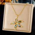 Starfish flower pendant necklace with gold-tone chain and blue enamel charm