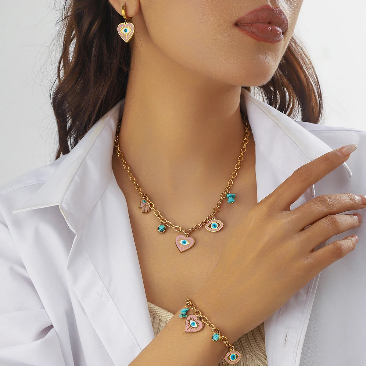 Gold-tone evil eye heart necklace with turquoise charms and matching drop earrings