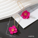 Floral stud earrings with layered hot-pink flower petals and gold-tone hooks