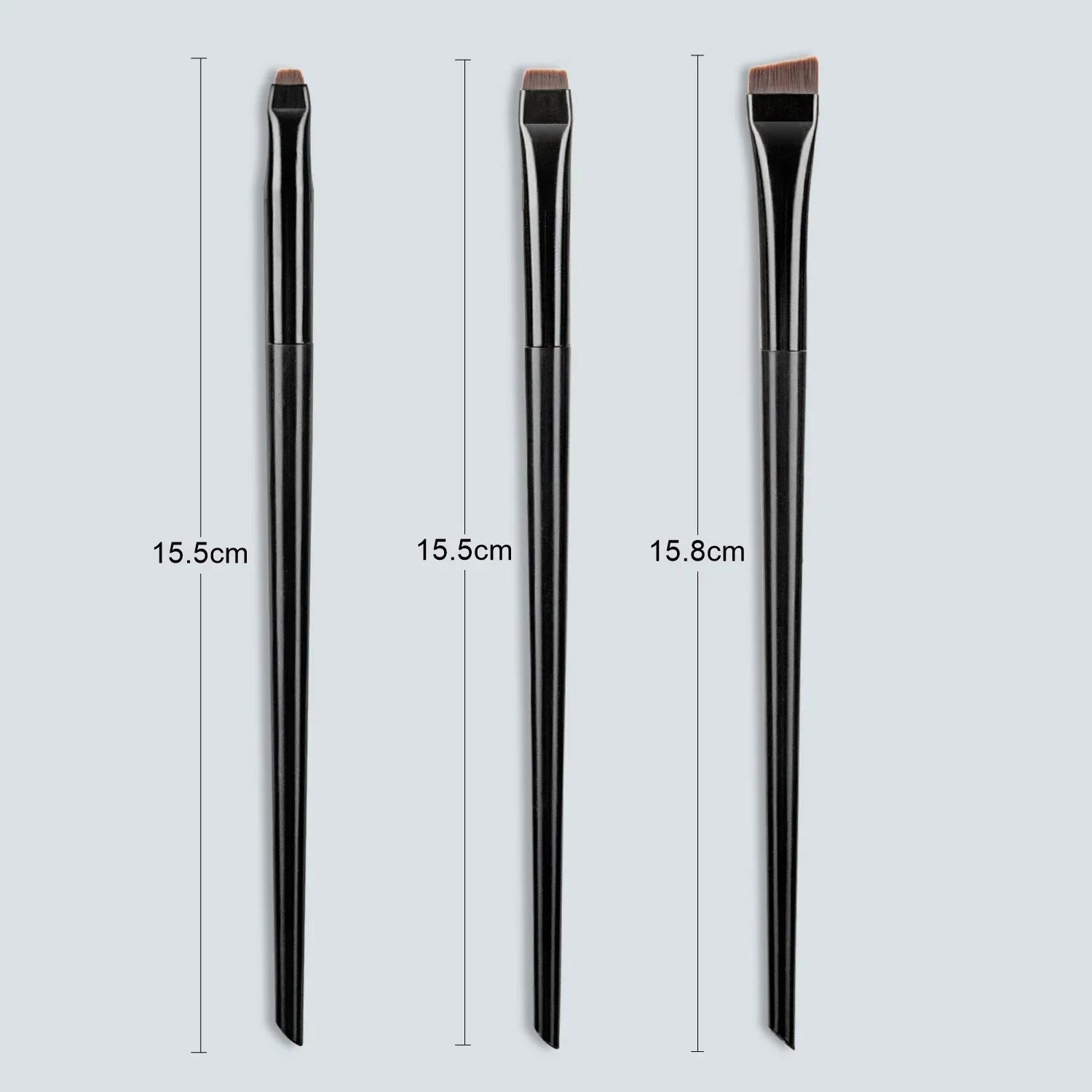 Eyeliner and eyebrow makeup brushes, three black handles with copper-toned bristles
