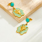 Gold-tone turquoise stud earrings with blue enamel pharaoh head drop charms