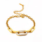 Gold thick chain geometric bracelet with rectangular pave centerpiece and linked clasp