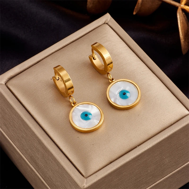 Gold-tone hoop earrings with blue eye cabochon drops