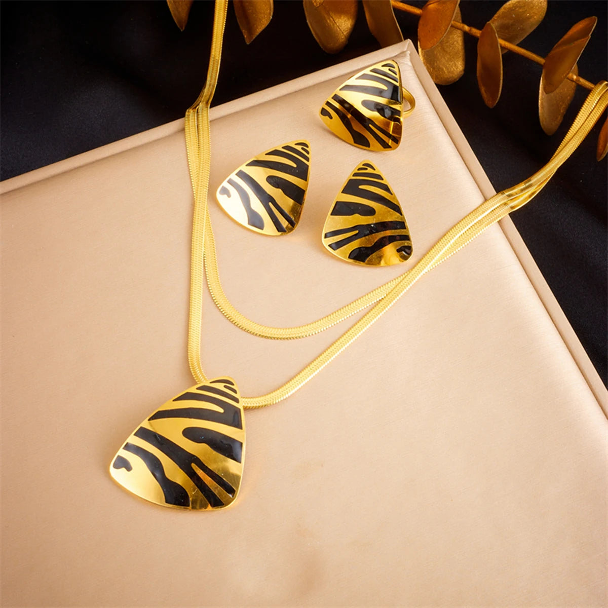 Tiger stripe teardrop pendant necklace with matching earrings, gold-tone accents