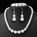 Pearl bridal set with pearl necklace, matching bracelet, and pearl drop earrings