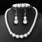 Pearl bridal set with pearl necklace, matching bracelet, and pearl drop earrings