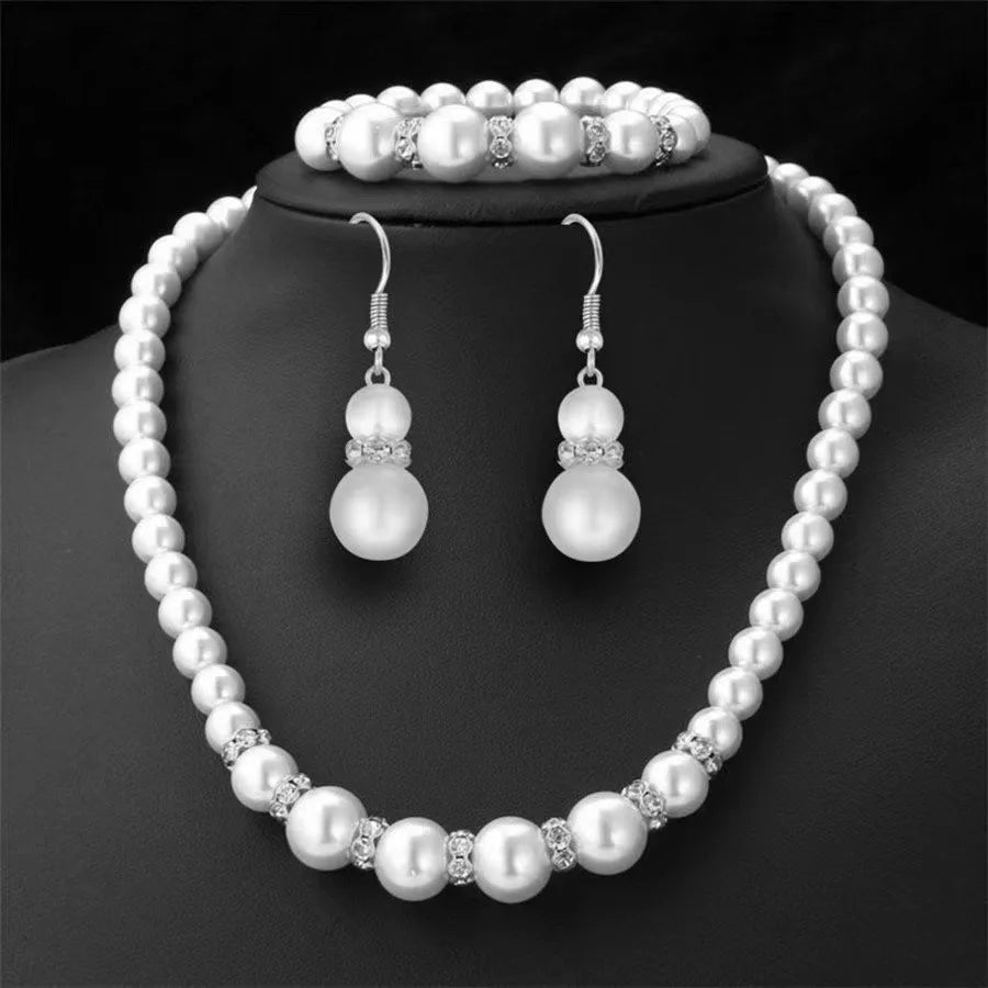 Pearl bridal set with pearl necklace, matching bracelet, and pearl drop earrings