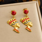 Gold-tone queen head earrings with red cabochon tops; blue enamel and red accents