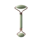 Facial massage roller with green handle, oval top stone plate, and rounded base roller