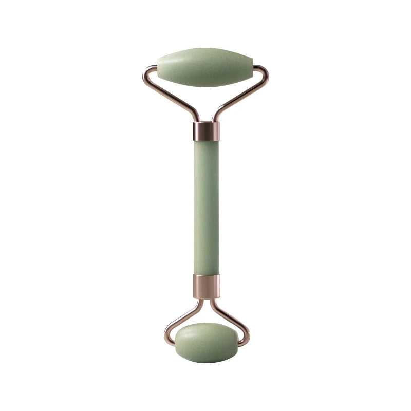 Facial massage roller with green handle, oval top stone plate, and rounded base roller