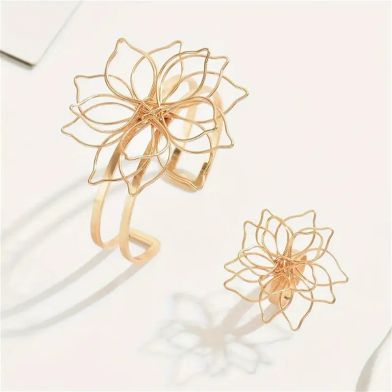 Gold-tone hollow flower bracelet cuff and ring, openwork blossom motif