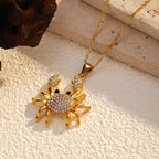 Rhinestone crab pendant necklace with gold-tone chain and crystal-studded crab charm